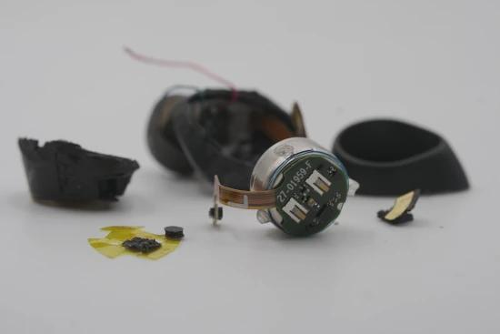 Disassembly of standard TWS headphones in the recycling process, manual labor for material disassembly